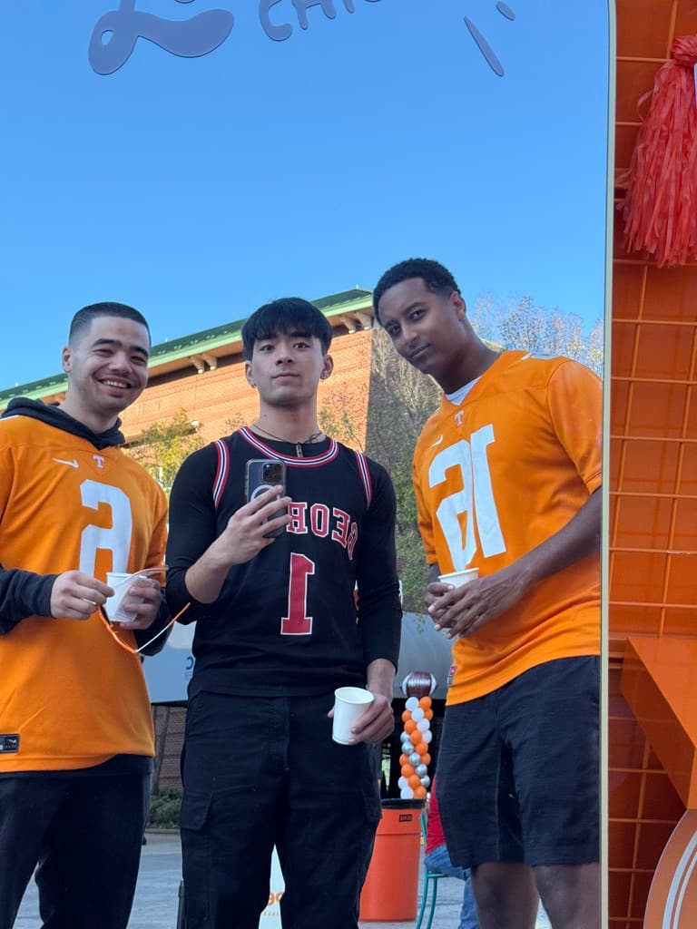 Liam with friends at a college football game