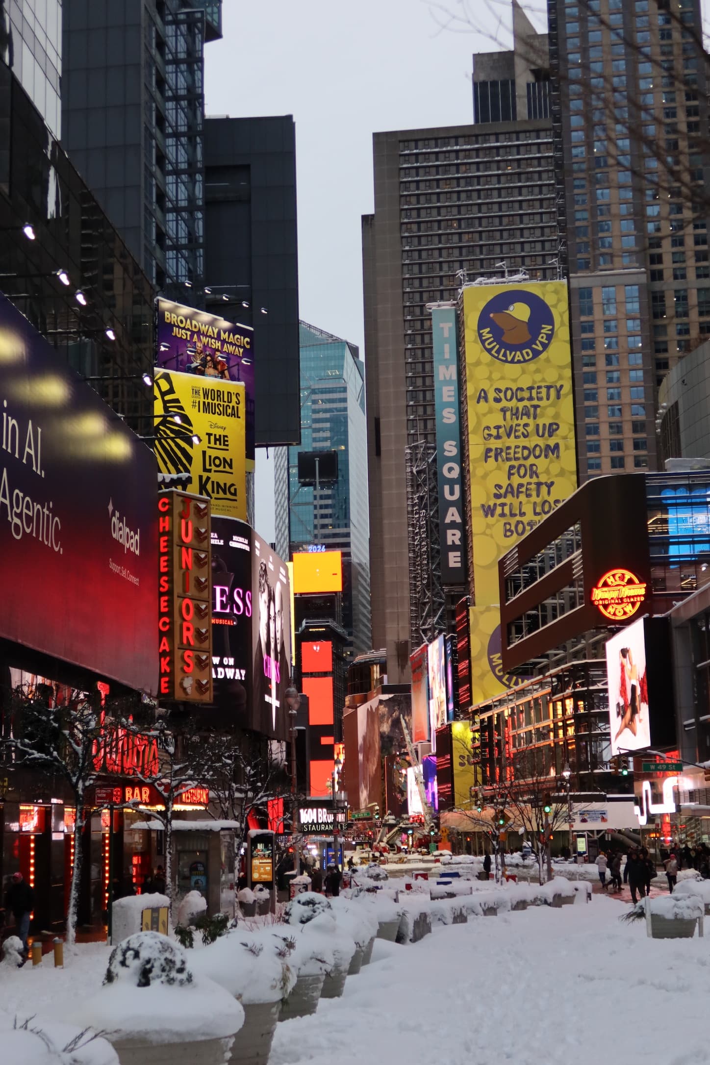 Snowy city street with Times Square signage